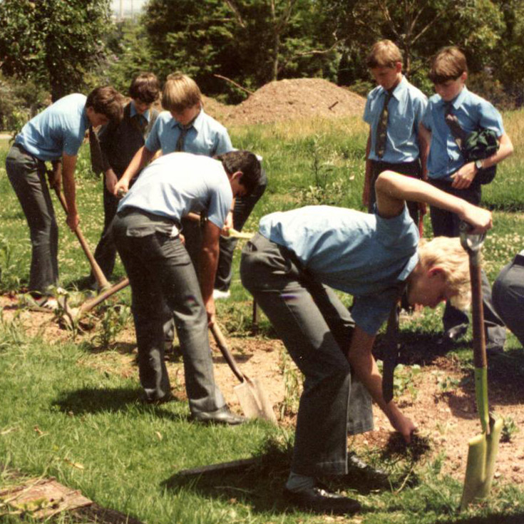 Historical image of St Patrick's Marist College Dundas students digging in garden