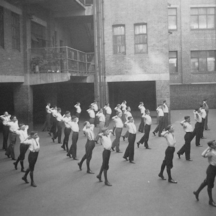 Historical image of St Patrick's Marist College Dundas students participating in calisthenics
